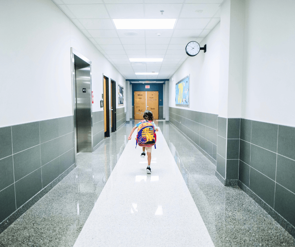 The Back-to-School Wellness Checklist for Parents blog with a picture of a classroom hallway