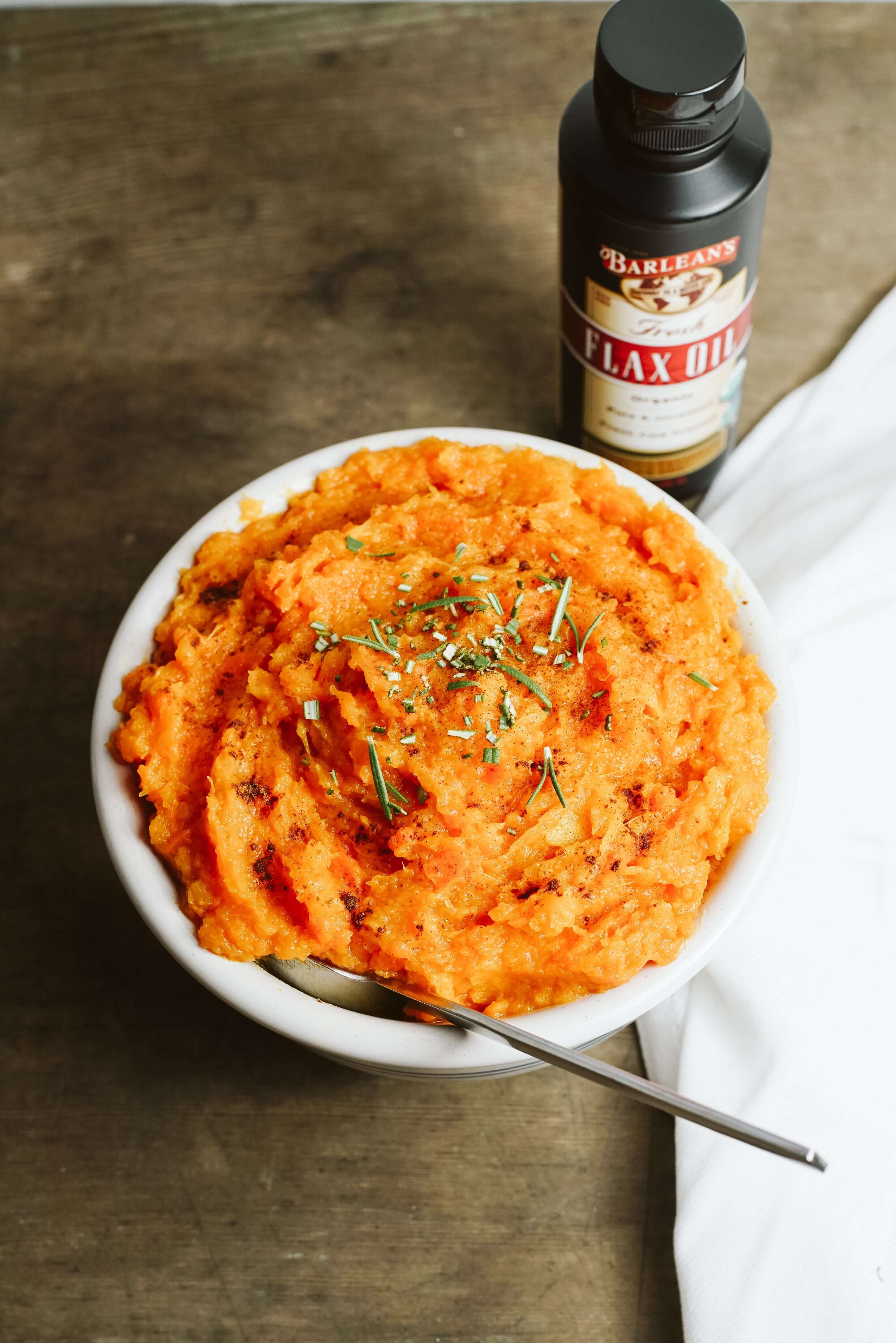 acorn squash and swee potato mash dish with flax oil on top