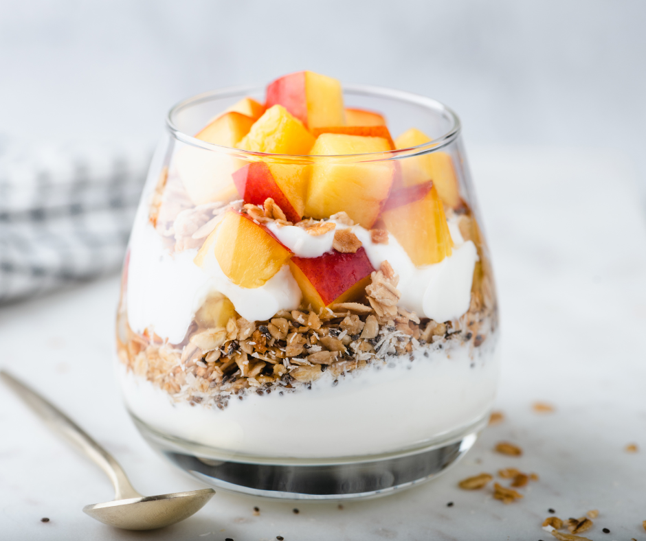 Parfait with granola and fruit on top paired with a drizzle of Barlean's Multivitamin