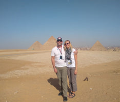 A Barlean's employee and her husband with Egyptian pyramids in the background.