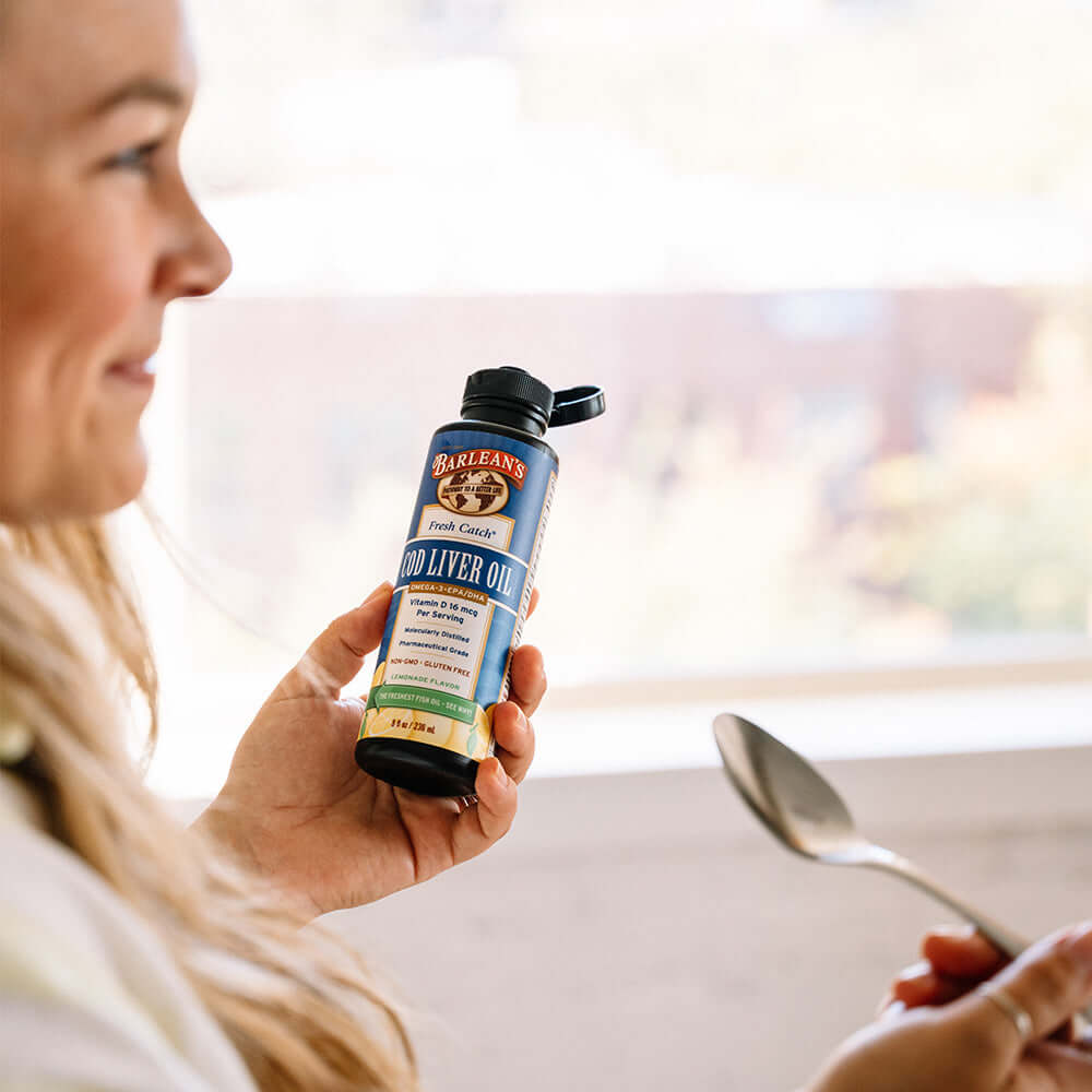 Cod liver oil supplement with citrus taste in a spoon