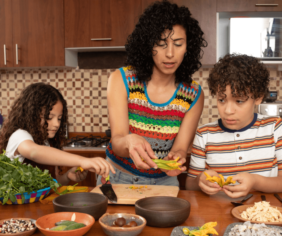 a mom in the kitchen preparing food with their son and daughter for a Back-to-School Nutrition Checklist