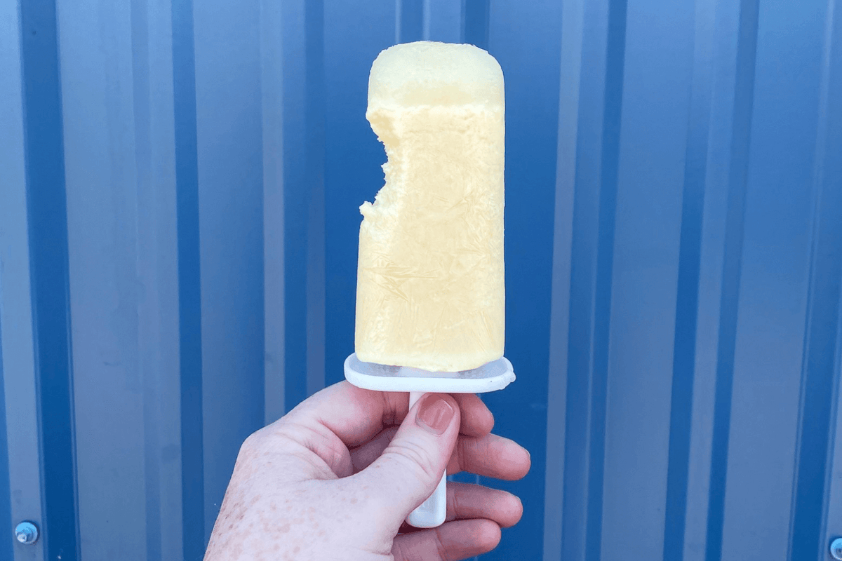 Pina Colada Omega-3 Popsicles against a blue background