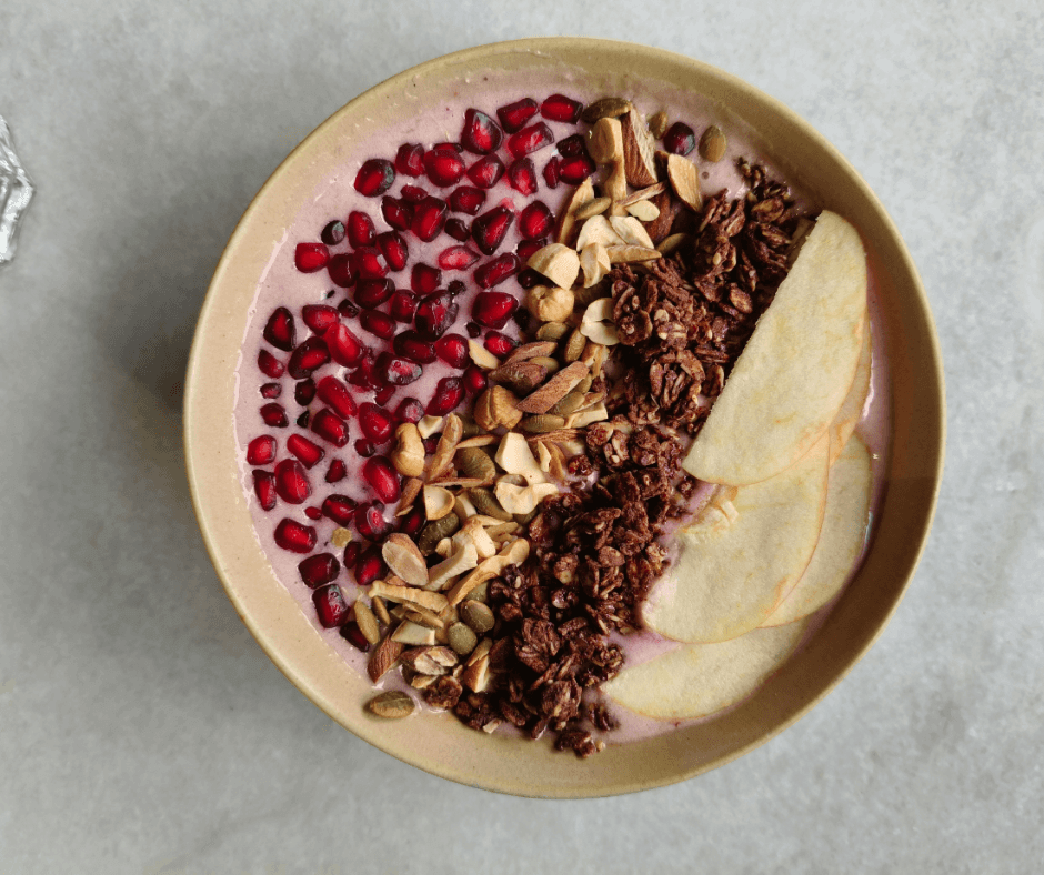 Tropical smoothie bowl topped with coconut and fruit
