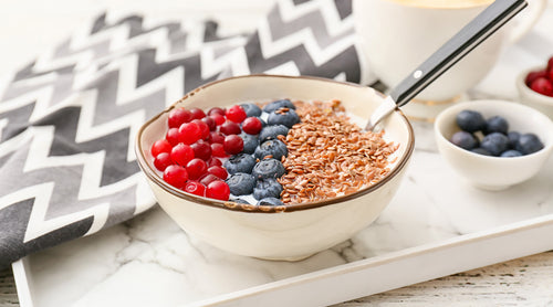 Image: Bowl of yogurt with fruits and flax seed on top