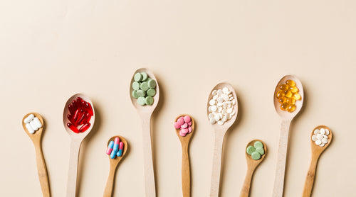 Image: Vitamins in wooden spoons