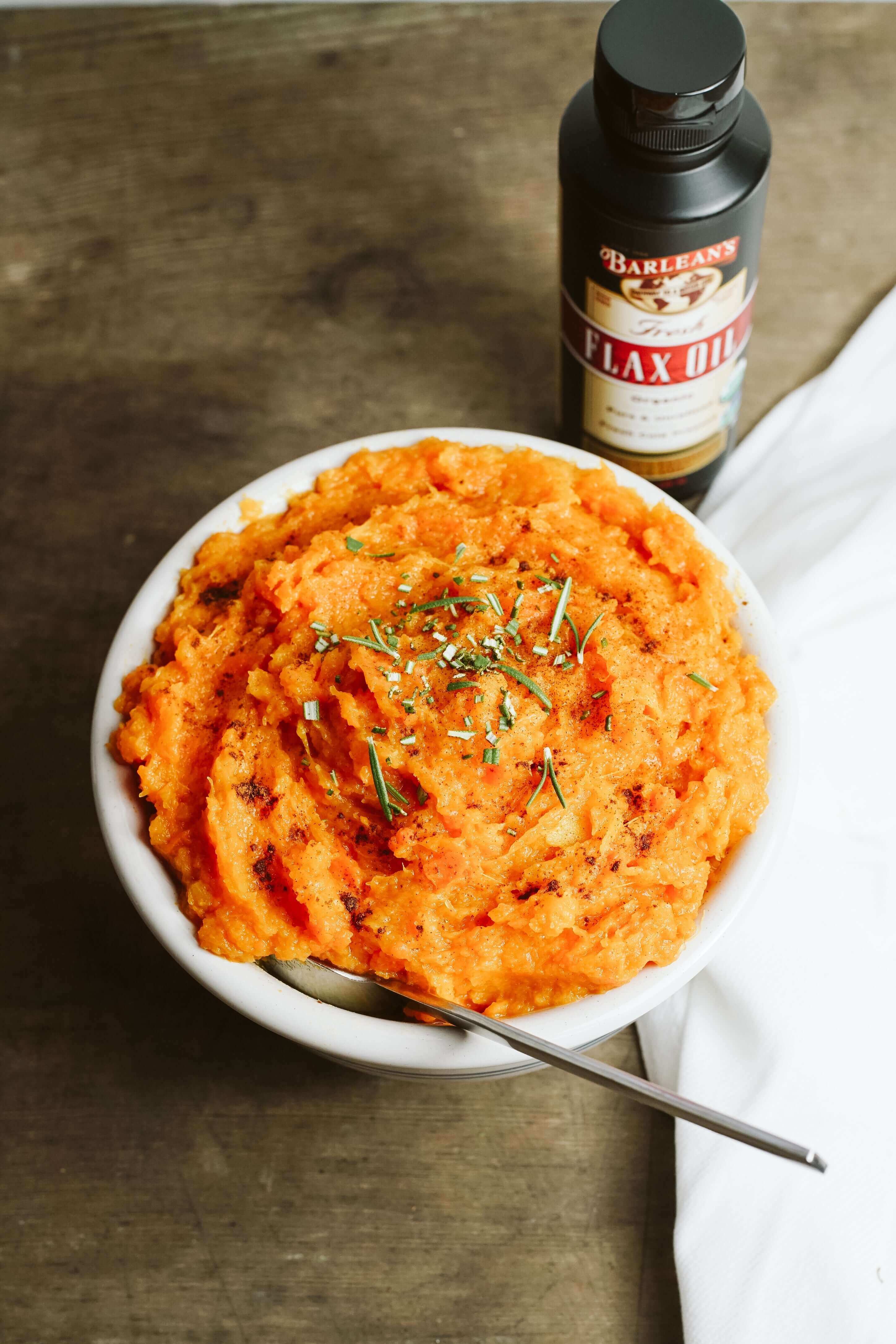 acorn squash and swee potato mash dish with flax oil on top