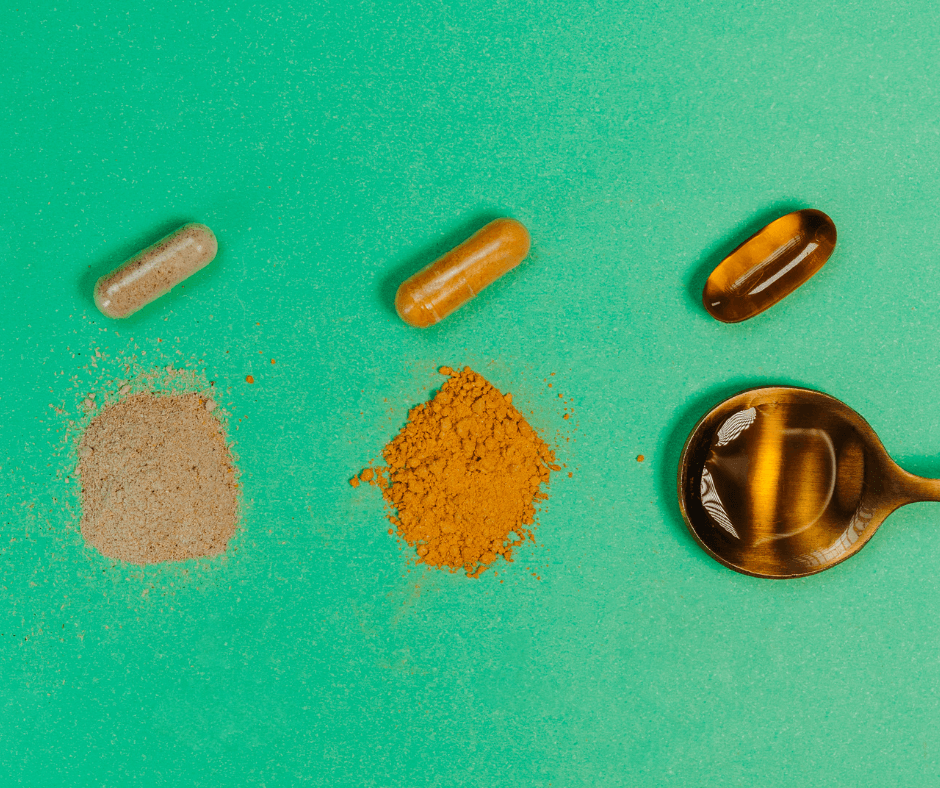 three different multivitamins capsules and powders and liquids on a teal green background