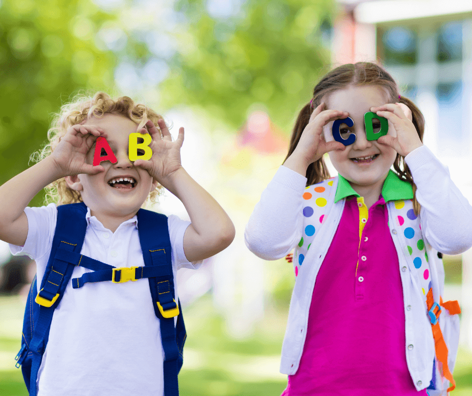 two kids outside with binoculars 