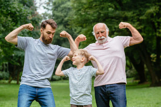 three men of different ages posing flexing their muscles for men's health awareness