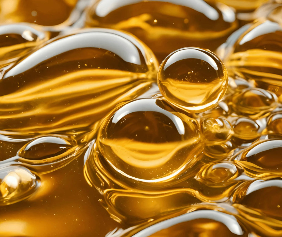 Module 3: Barlean's 3X Better Absorption - close-up of golden oil droplets showcasing absorption technology.