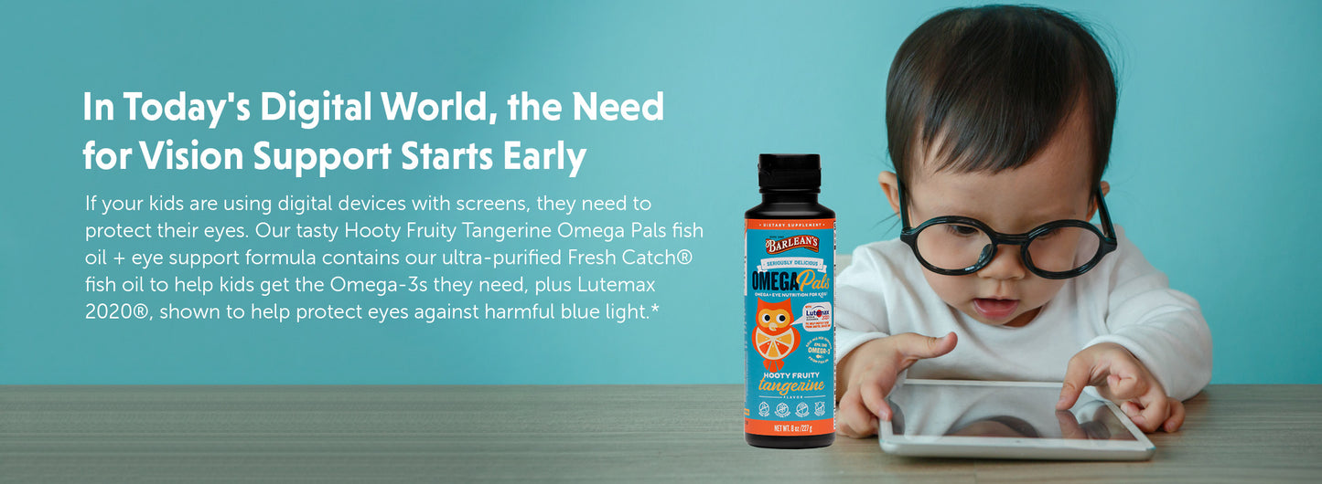 A bottle of Barlean's Omega Pals in Hooty Fruity Tangerine next to a baby wearing glasses and looking at a tablet.